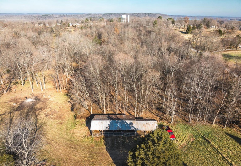 Birds eye view of property with a rural view
