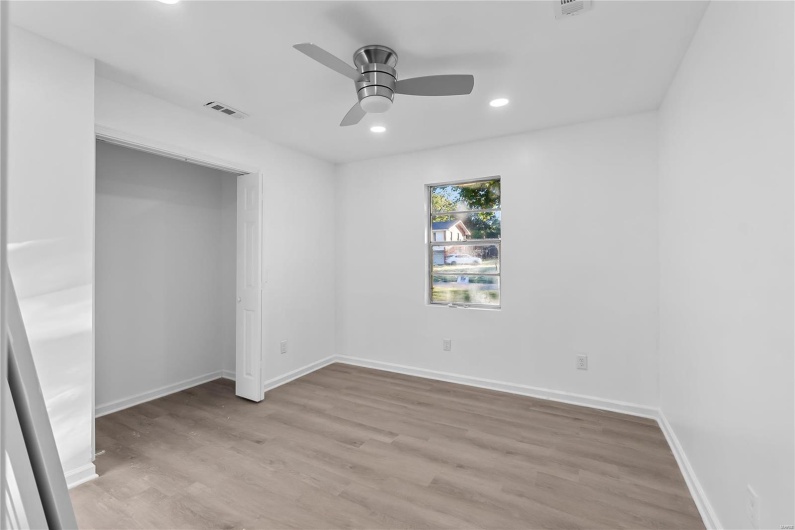 Empty room featuring ceiling fan and light hardwood / wood-style floors