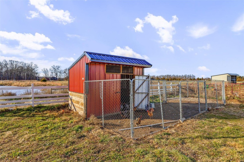 View of outbuilding with a rural view