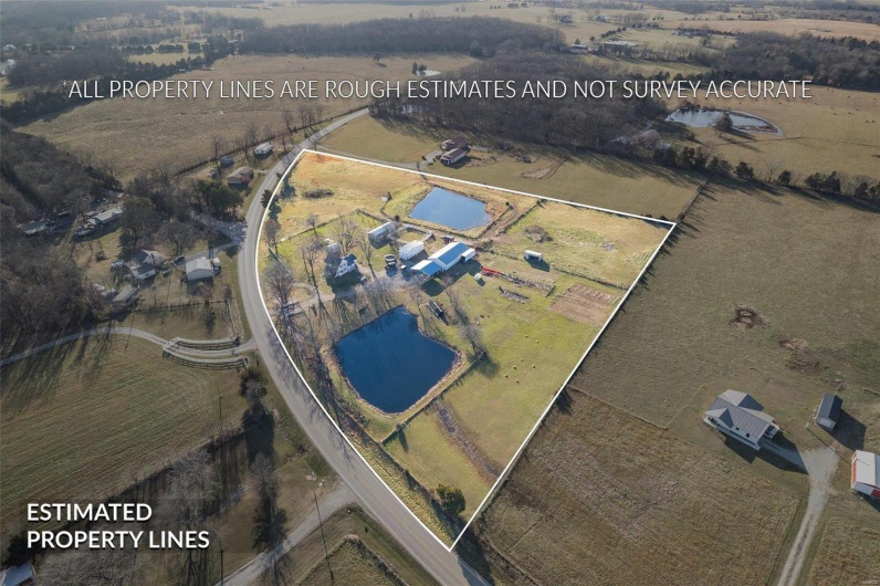 Drone / aerial view with a water view and a rural view