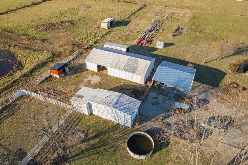Birds eye view of property featuring a rural view