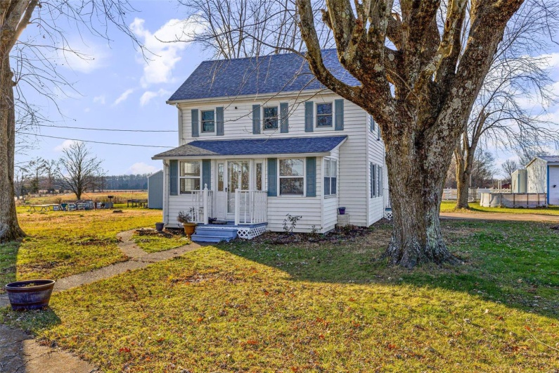 View of front of property with a front yard