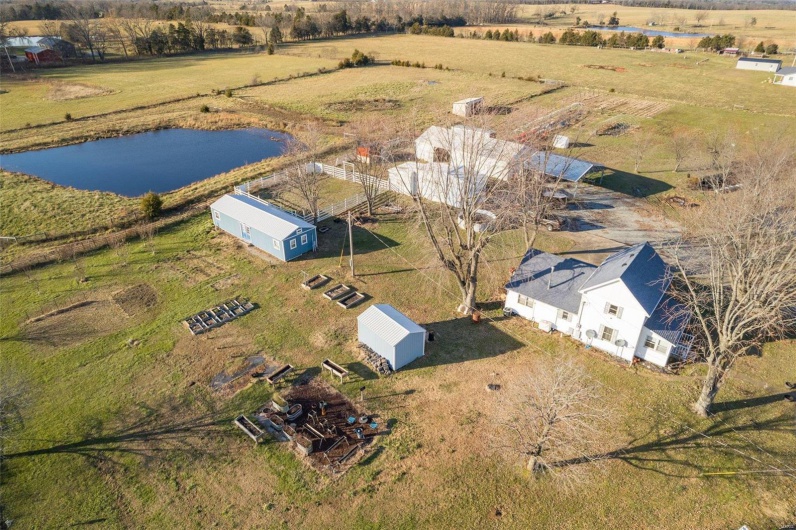 Birds eye view of property featuring a rural view and a water view