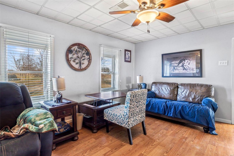Dining space featuring ceiling fan and light hardwood / wood-style floors
