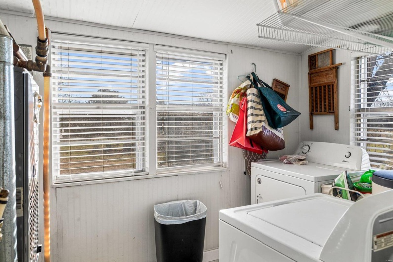 Washroom featuring separate washer and dryer