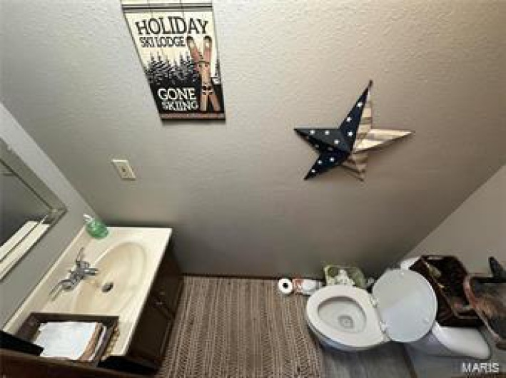 Bathroom featuring vanity and toilet