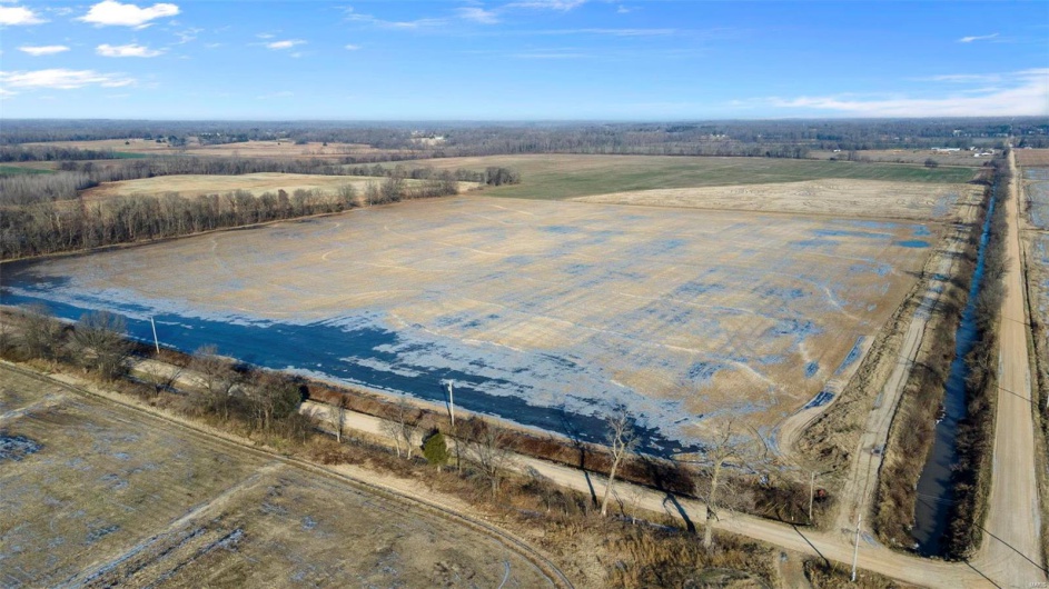 Birds eye view of property with a rural view