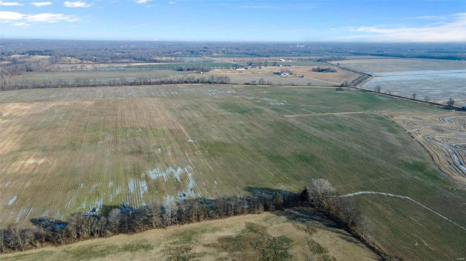 Drone / aerial view with a water view and a rural view