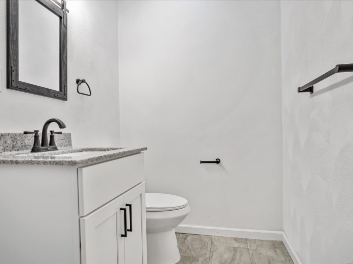 Bathroom with vanity and toilet