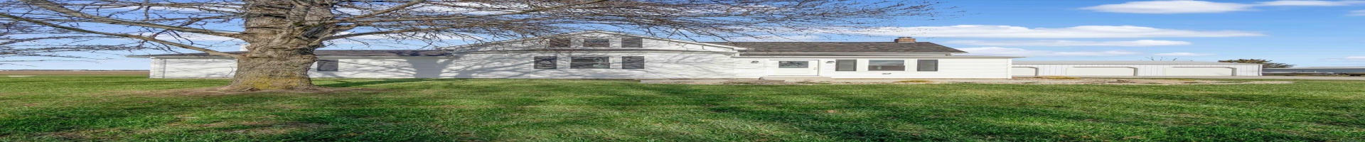 Residential For Sale View of front facade with a front yard, a garage, and an outdoor structure