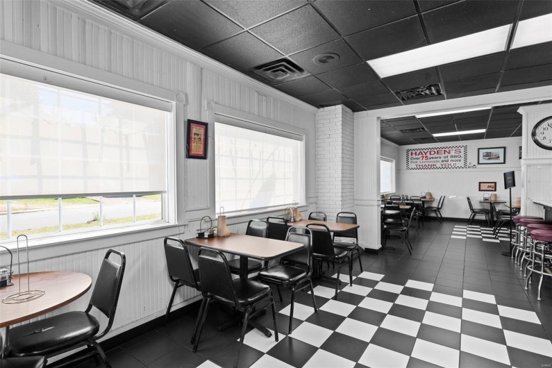 Dining space with a drop ceiling and ornamental molding