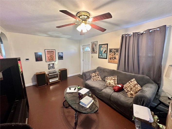 Living room featuring ceiling fan