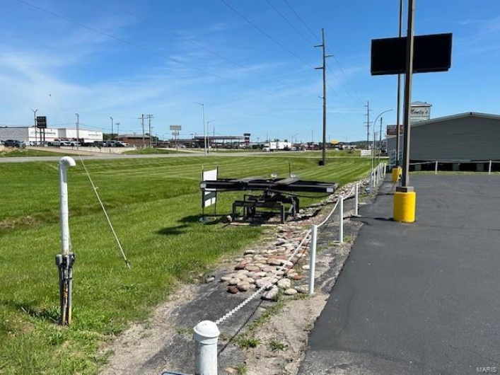 View of community featuring a yard