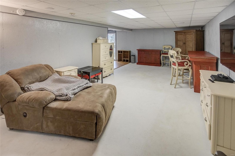Living room featuring a paneled ceiling