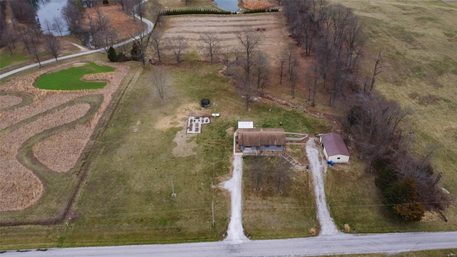 Birds eye view of property featuring a rural view