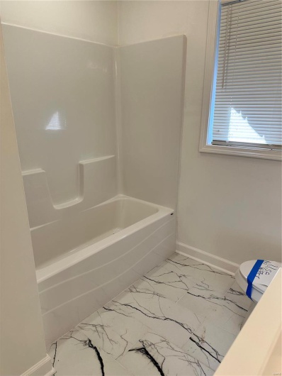 Bathroom with toilet and  shower combination