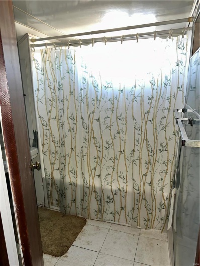 Bathroom featuring tile patterned flooring