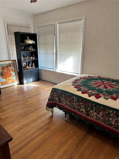 Bedroom with light hardwood / wood-style flooring