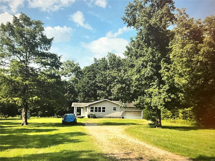Looking at the beautiful wooded 2+/-acre lot
