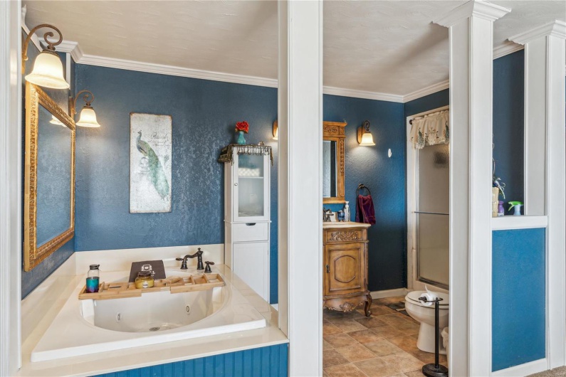 Primary en suite Bathroom with a shower as well as tub to relax in