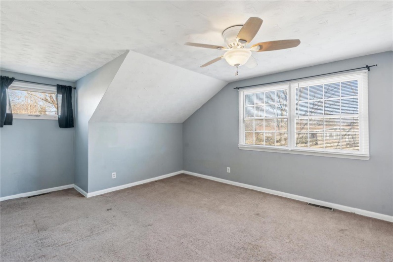 Bedroom with ceiling fan.