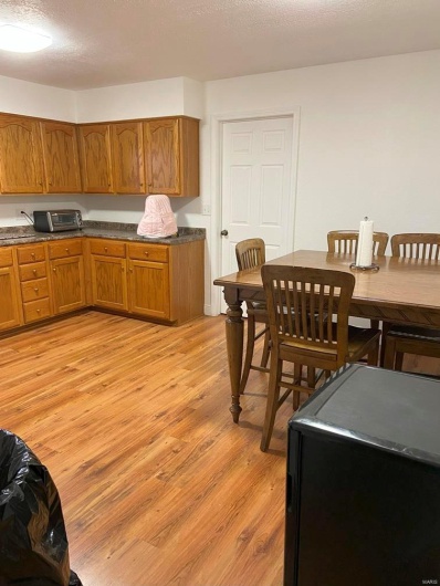 Kitchen featuring light hardwood / wood-style floors and a textured ceiling