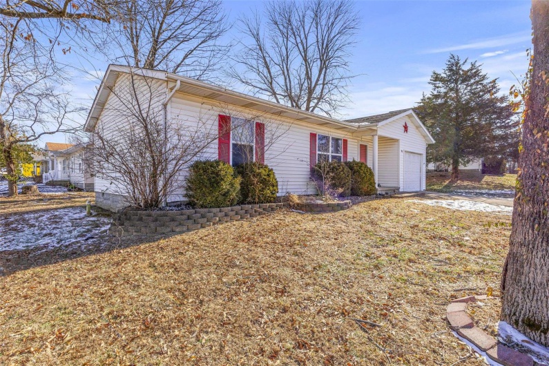 View of front of property featuring a garage