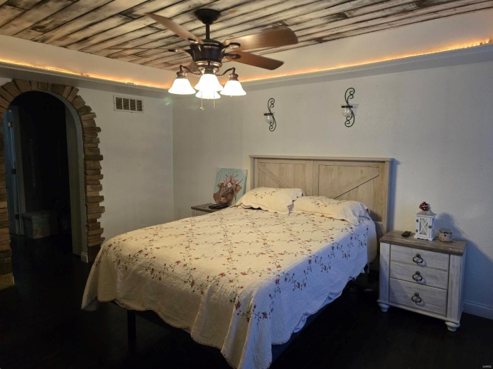 Bedroom featuring ceiling fan and wooden ceiling