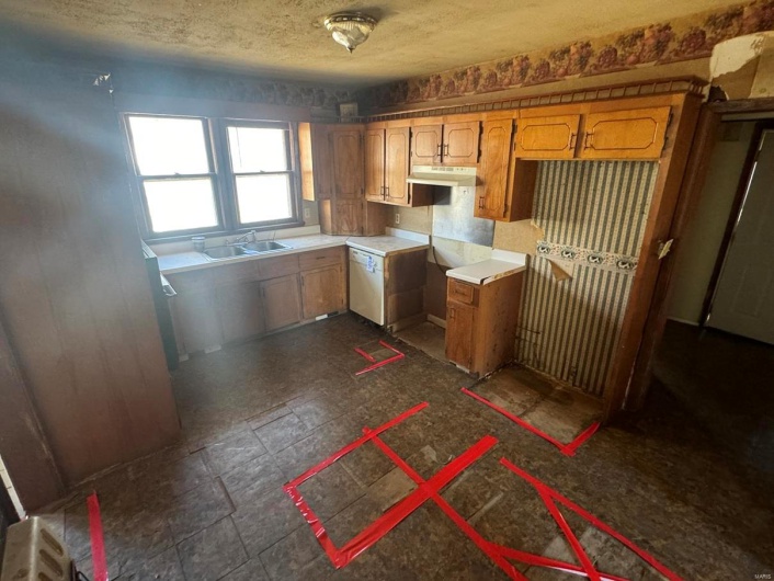 Kitchen featuring sink and a textured ceiling