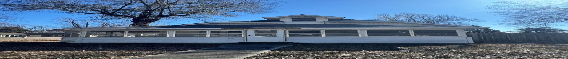 Residential For Sale View of front facade with a sunroom