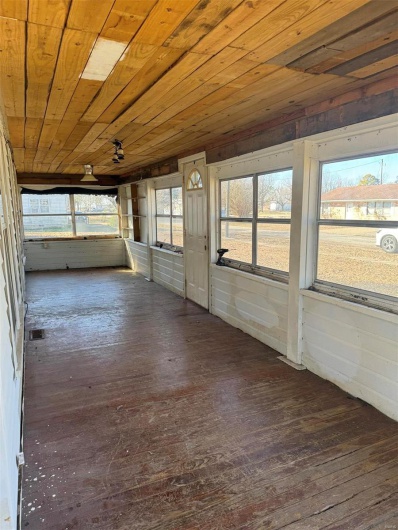 Unfurnished sunroom featuring wood ceiling