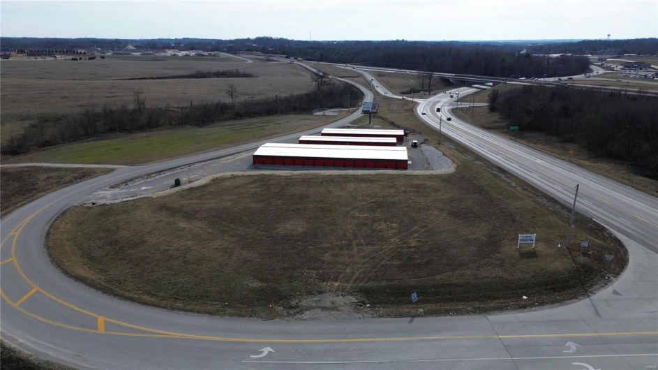 Birds eye view of property with a rural view