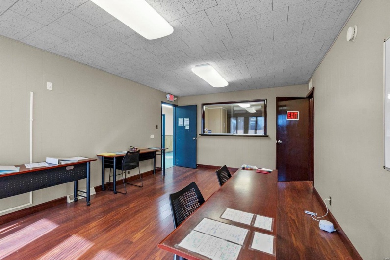 Dining area featuring dark wood-type flooring