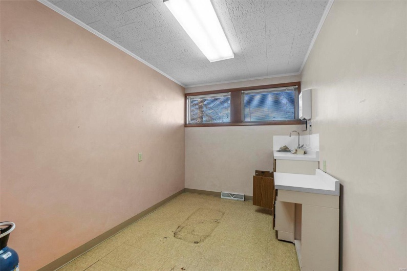 Unfurnished room with ornamental molding