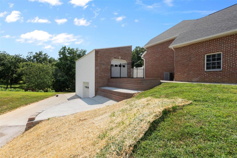View of home's exterior with a yard