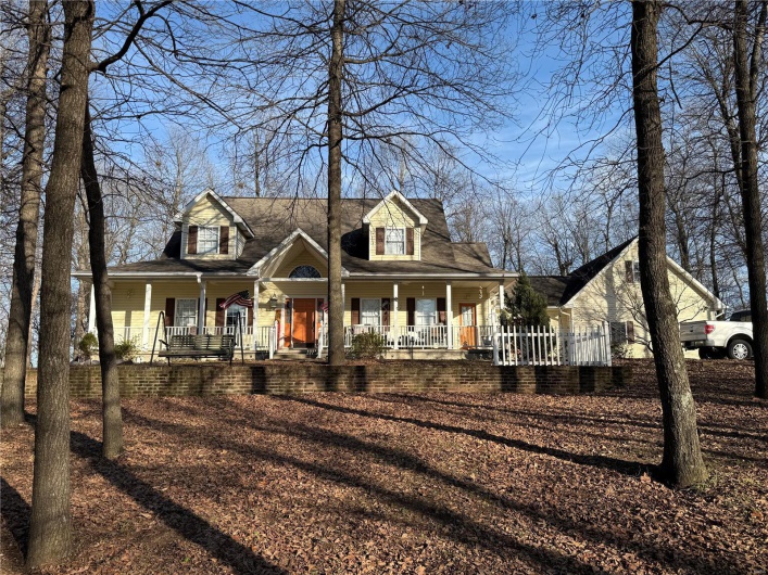 Farmhouse featuring a porch