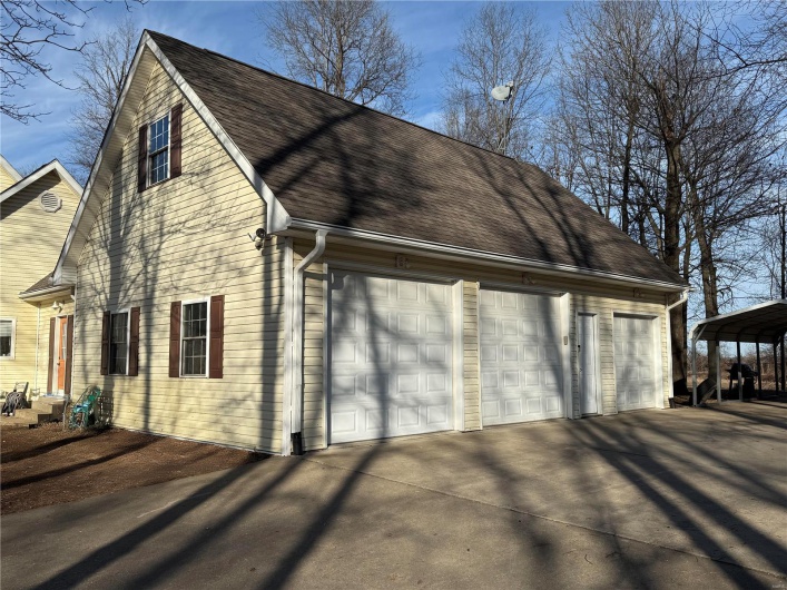 View of home's exterior with a carport
