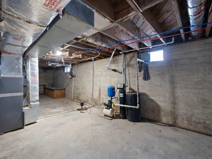 Basement featuring heating unit