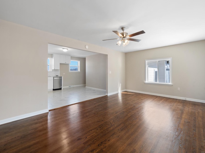 Spare room featuring hardwood / wood-style flooring and ceiling fan