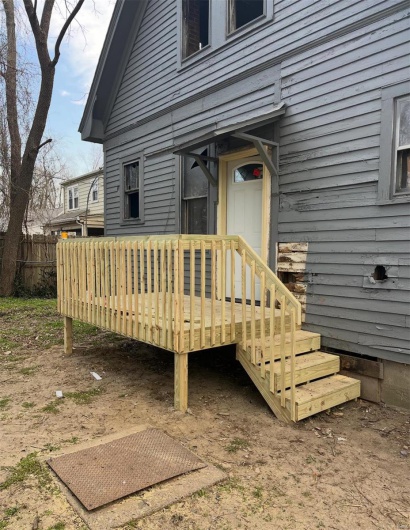 Doorway to property featuring a deck