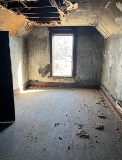 Bonus room featuring vaulted ceiling and wood-type flooring