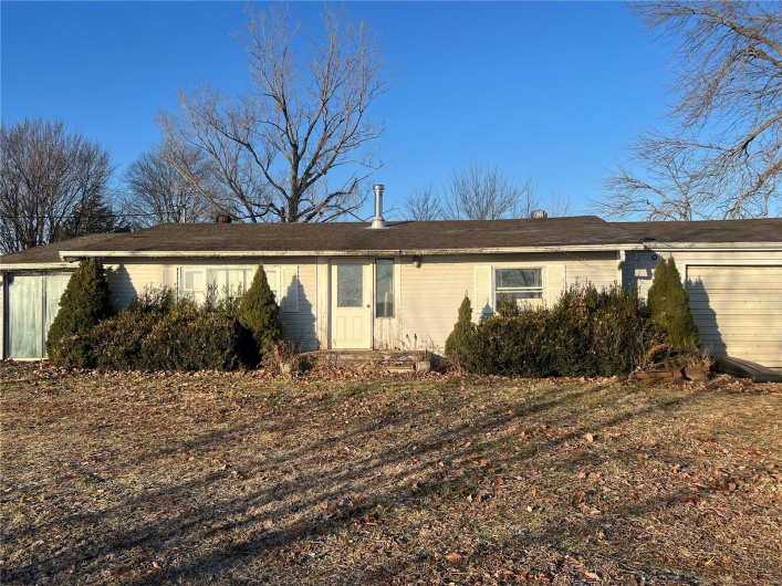 View of front facade featuring a garage