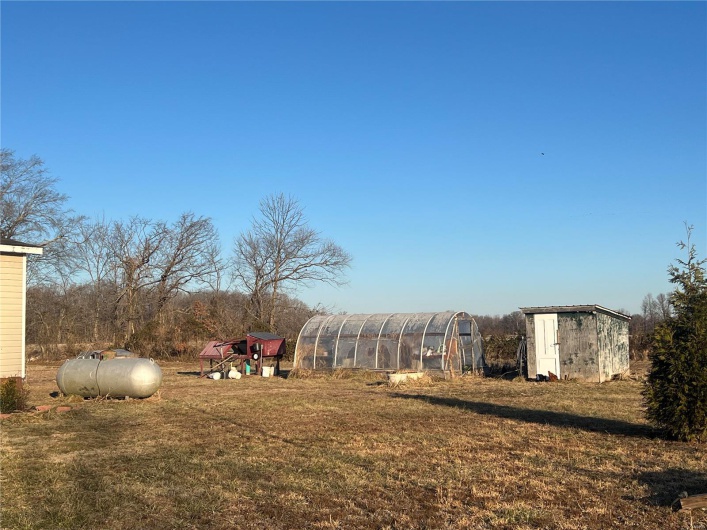 View of yard featuring a storage unit