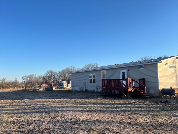 Rear view of property featuring a deck