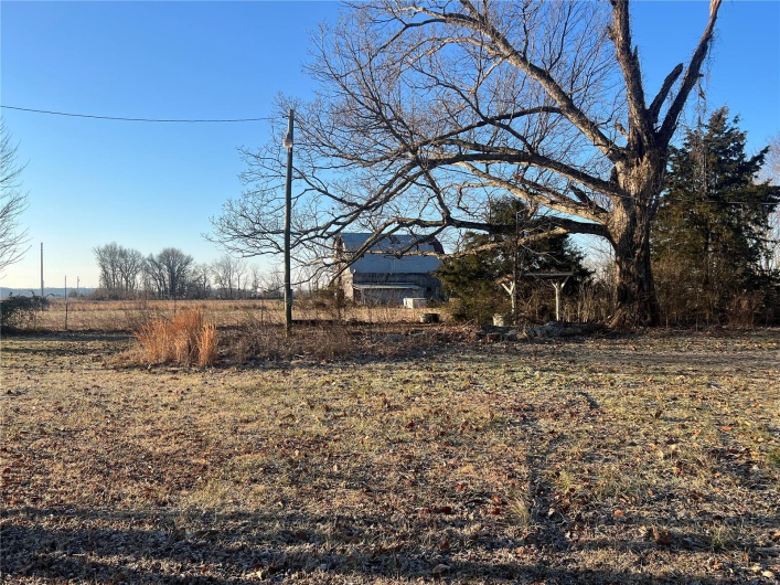 View of yard with a rural view