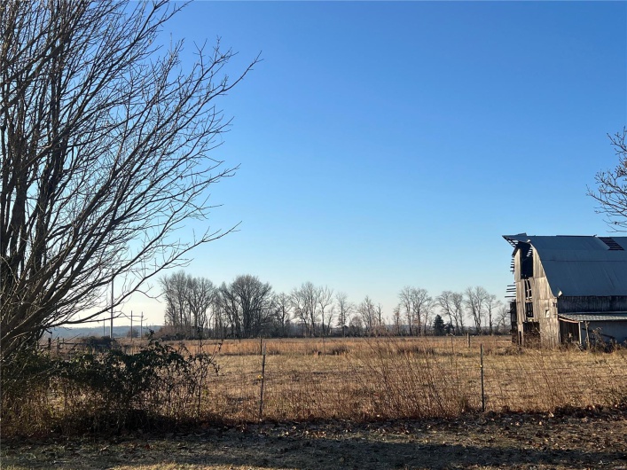 View of yard with a rural view