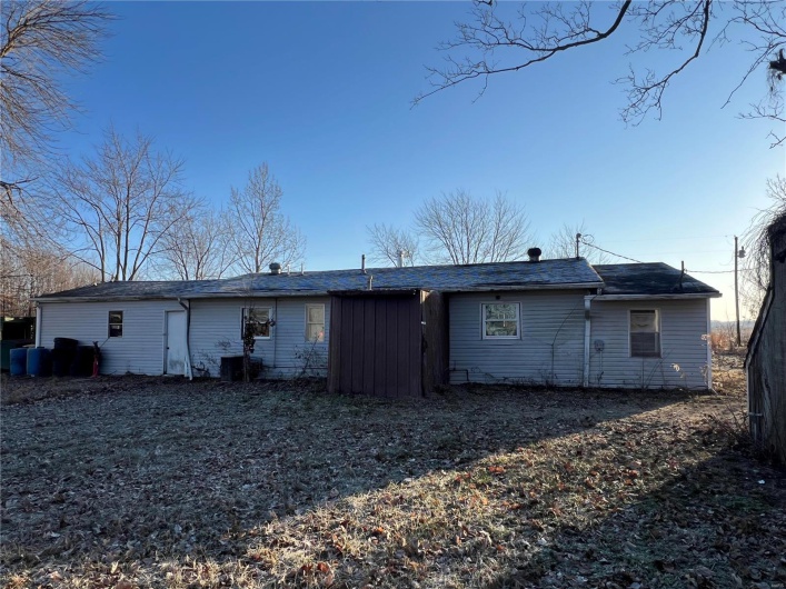 Rear view of property with central AC unit
