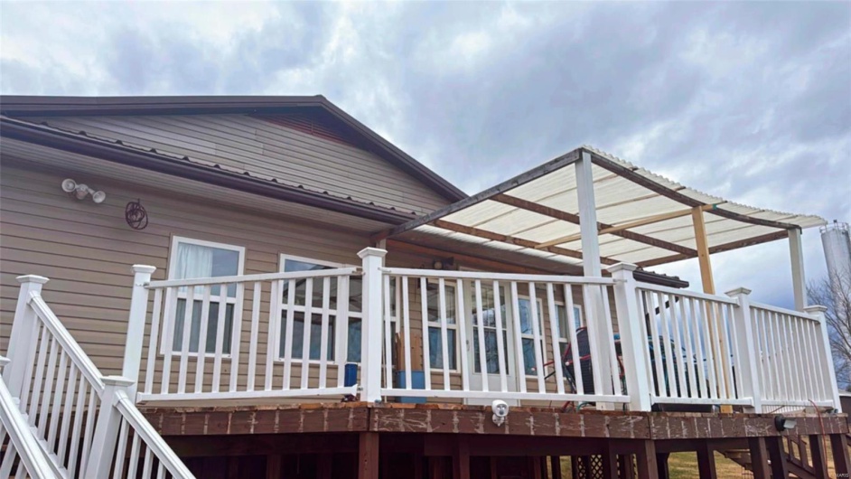View of side of property with a deck