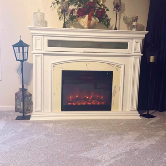 Interior details with carpet flooring and a high end fireplace