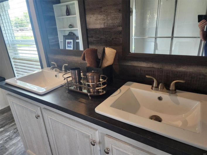 Bathroom featuring vanity and wood-type flooring
